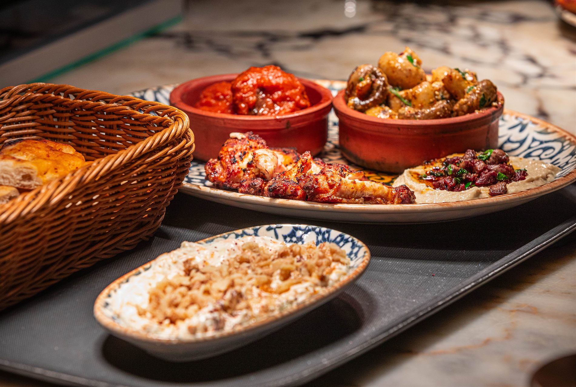 A spread of hot and cold mezze with bread at Elif
