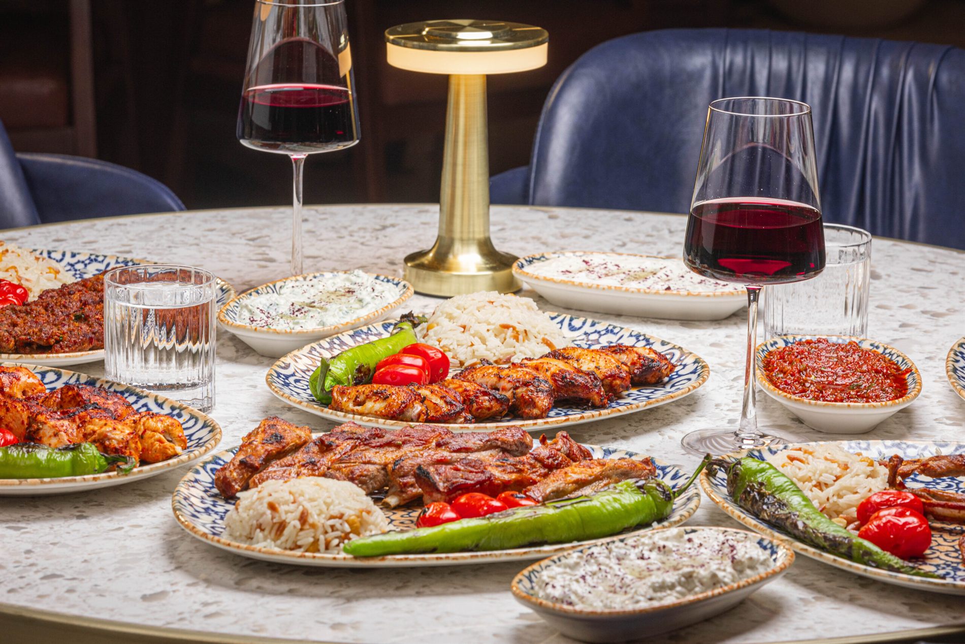 A table set with wine and a spread of dishes